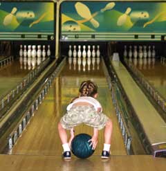Little girl bowling
